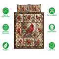 Cardinal quilt bedding set with red bird panels, holly berries, blossoms, and a warm woodland color palette