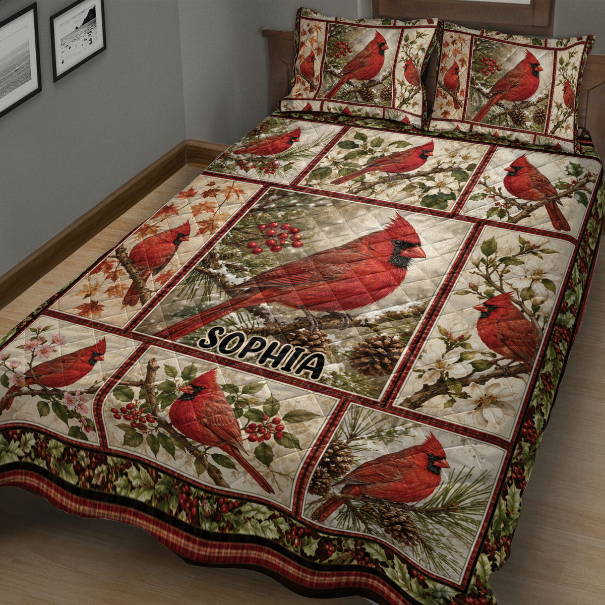 Close bedroom view of a cardinal quilt blanket featuring red birds, autumn leaves, blossoms, and pinecones