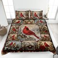 Cardinal quilt blanket displayed on a bed with snowy woodland scenes, birdhouses, pinecones, and winter foliage