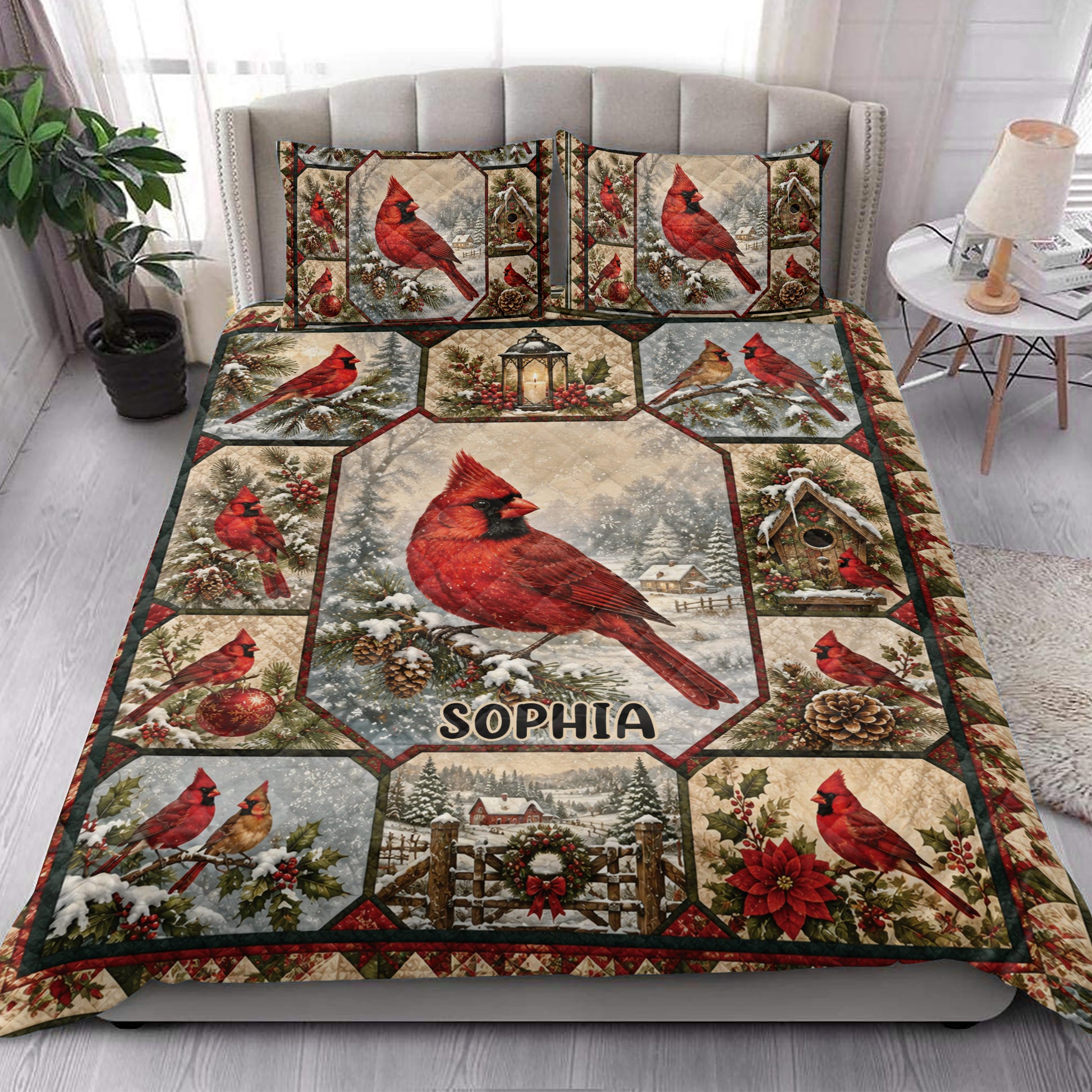 Cardinal quilt blanket styled on a bedroom bed with red birds, snowy branches, birdhouses, and winter accents