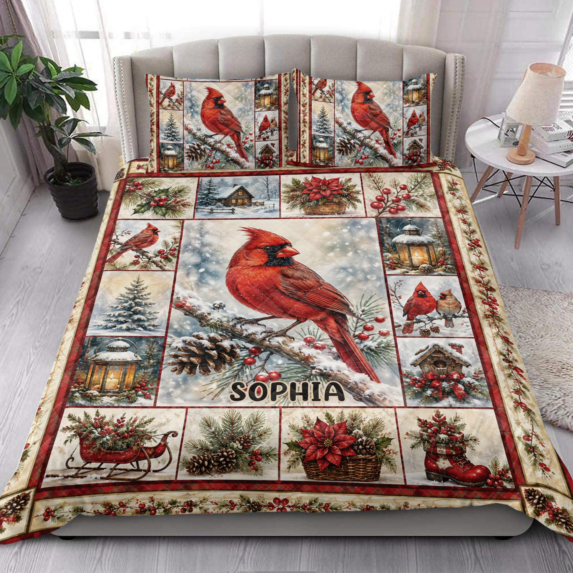 Cardinal quilt blanket styled on a bright bedroom bed with red birds, berries, lanterns, and snow scenes