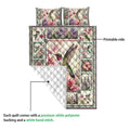 Hummingbird quilt showing the printed floral side and white quilted backing