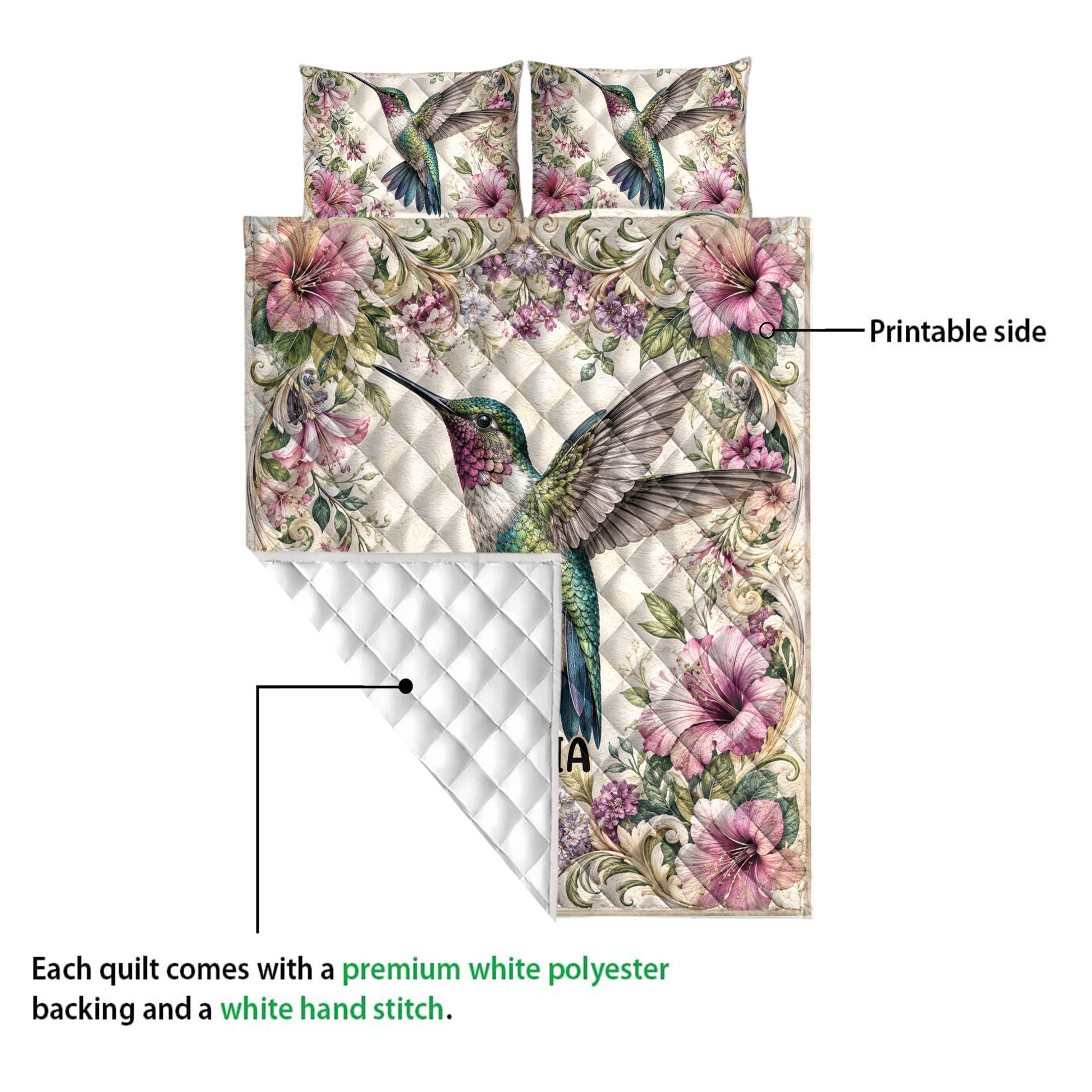 Hummingbird quilt showing the printed floral front and white diamond-stitched backing