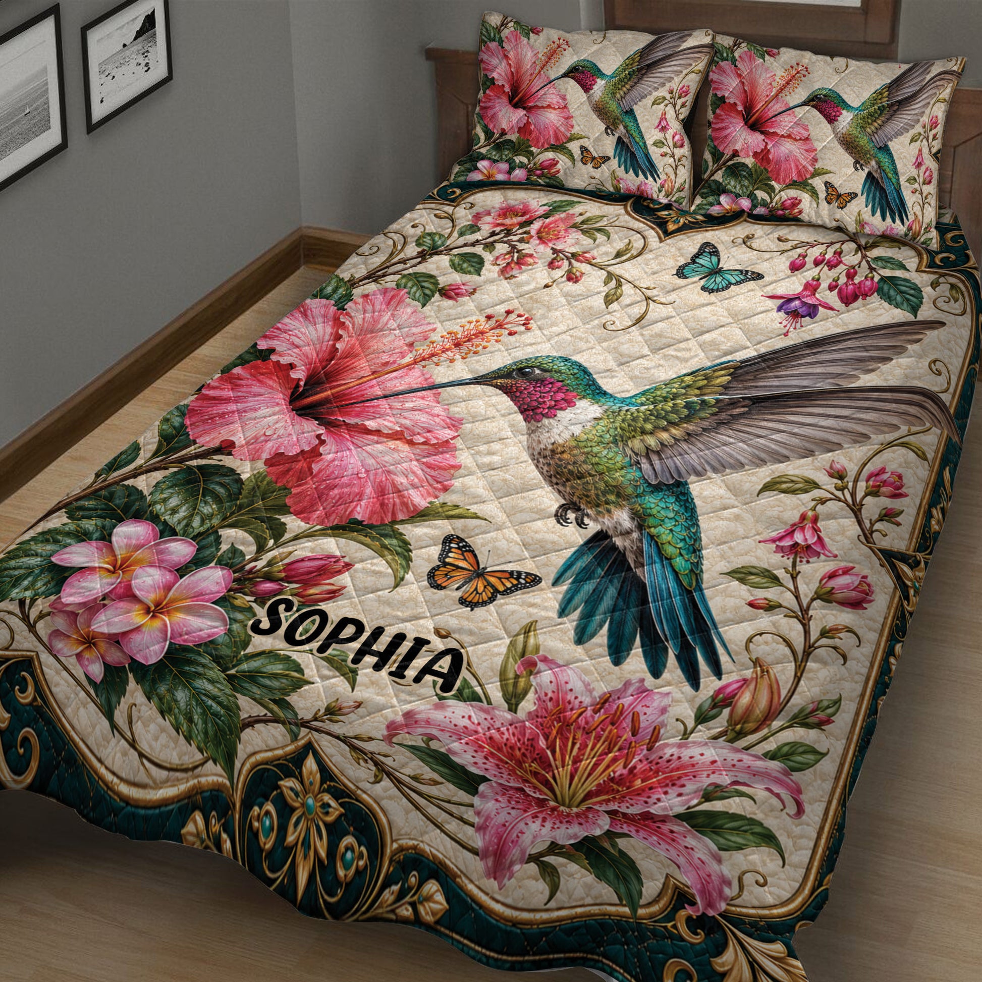 Close view of hummingbird quilt bedding with hibiscus flowers, tropical foliage, and ornate borders