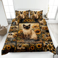 Siamese cat quilt blanket with sunflower collage artwork displayed on a bedroom bed