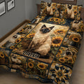 Siamese cat quilt blanket with sunflower panels and cat artwork in a cozy bedroom