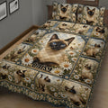 Close bedroom view of a Siamese cat quilt blanket with daisy flowers and repeated cat portraits