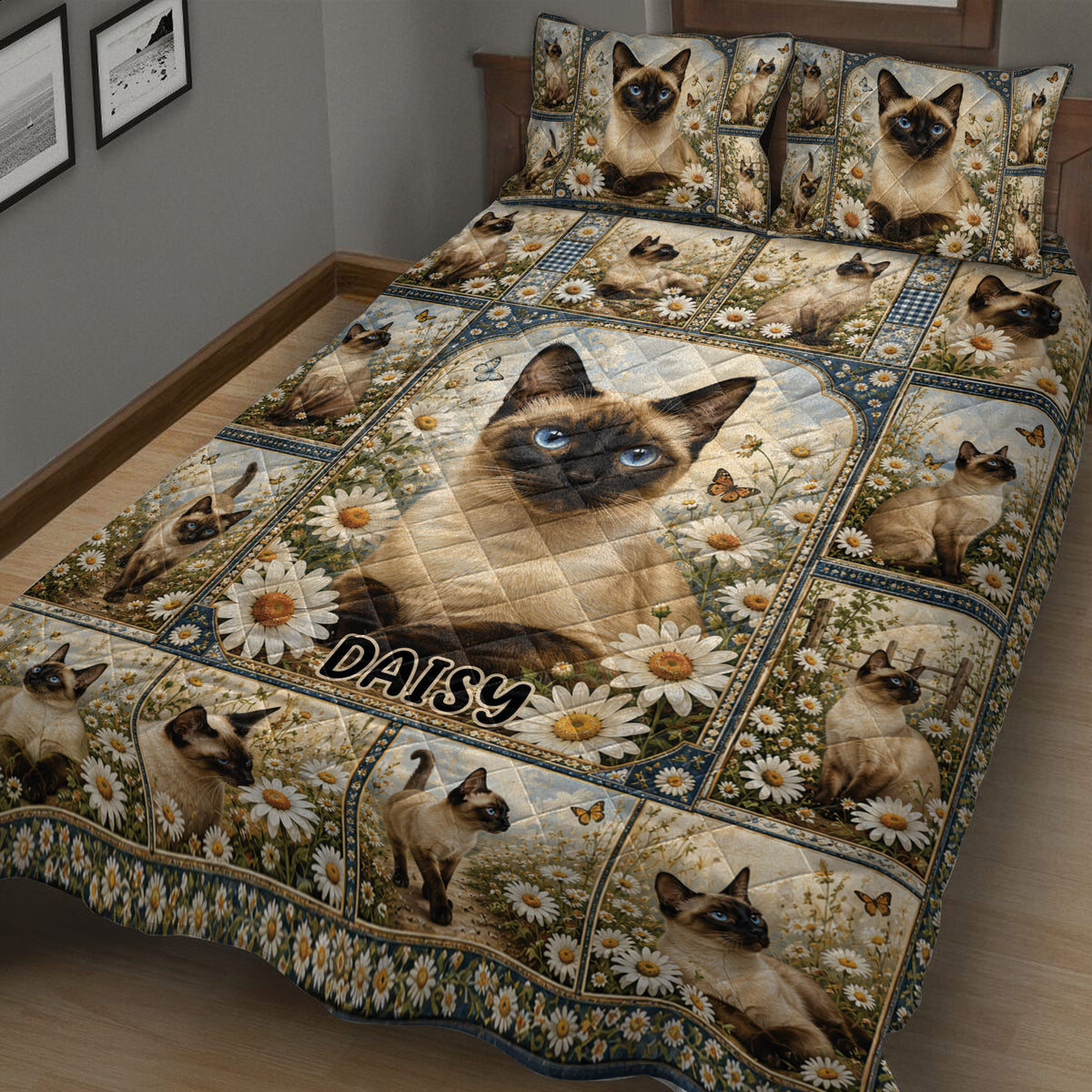 Close bedroom view of a Siamese cat quilt blanket with daisy flowers and repeated cat portraits