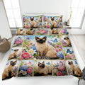 Siamese cat quilt blanket displayed on a bed with colorful flowers and butterflies