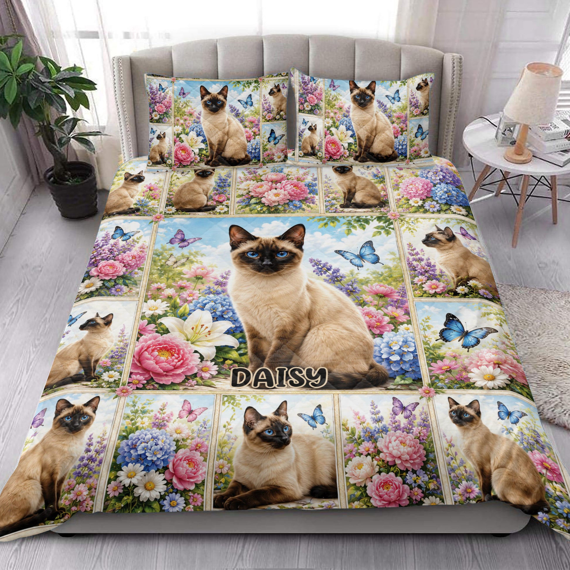 Siamese cat floral quilt blanket styled across a bright bedroom with coordinating pillows