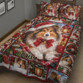 Close-up of a Christmas Sheltie quilt blanket featuring a central dog portrait, bows, bells, and holiday panels