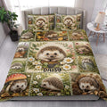 Hedgehog quilt blanket styled on a bedroom bed with flowers, leaves, berries, and woodland scenes