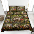 Hedgehog quilt blanket bedding set displayed on a bed with woodland flowers, mushrooms, and forest greenery