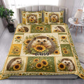 Hedgehog and sunflower quilt blanket styled on a bed in a bright bedroom