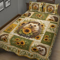 Close view of a hedgehog quilt blanket with sunflower artwork on a bedroom bed