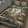 Close angled view of Greyhound quilt blanket bedding with botanical panels and multiple sighthound portraits