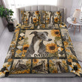 Greyhound quilt blanket styled in a bright bedroom with large portrait artwork and sunflower borders