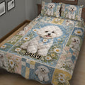 Close bedroom view of a Bichon Frise quilt blanket with repeated dog portraits, daisies, and patchwork details