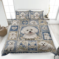 Blue floral Bichon Frise quilt blanket displayed on a bed with coordinating dog artwork