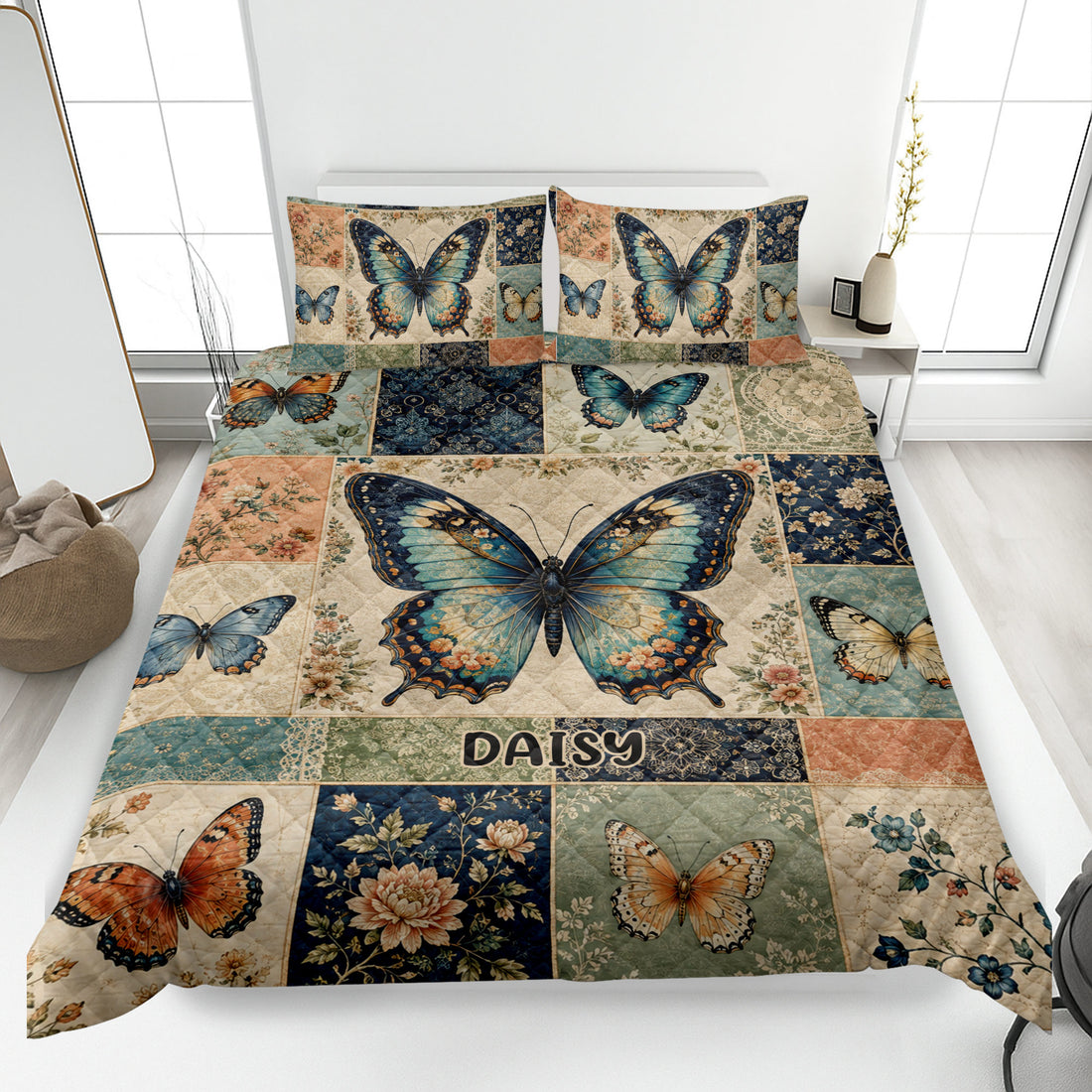 Vintage butterfly quilt blanket spread across a bed with floral patchwork artwork and blue, teal, and orange butterflies