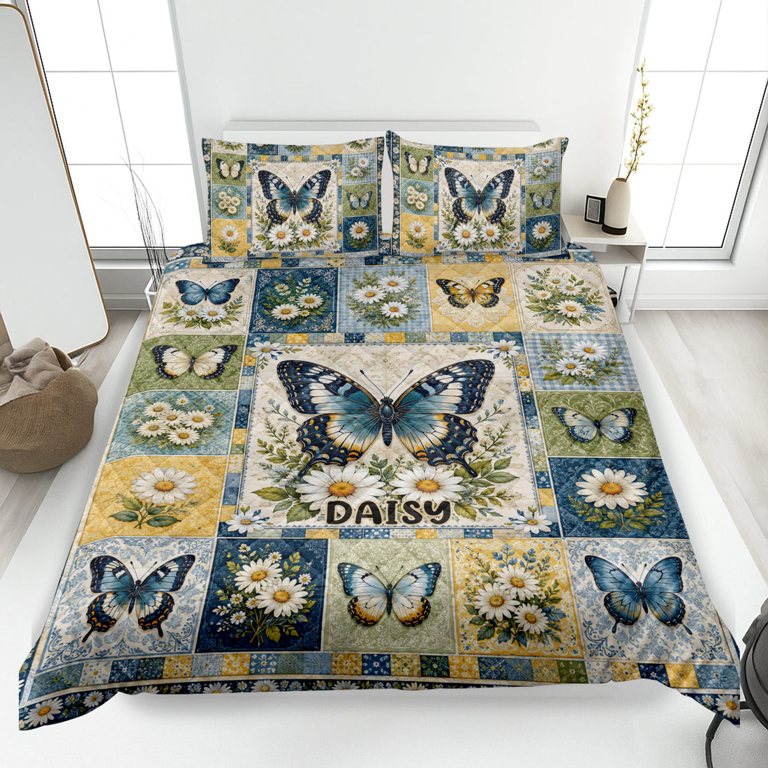 Butterfly quilt blanket displayed on a bed with blue, gold, green, and daisy patchwork artwork