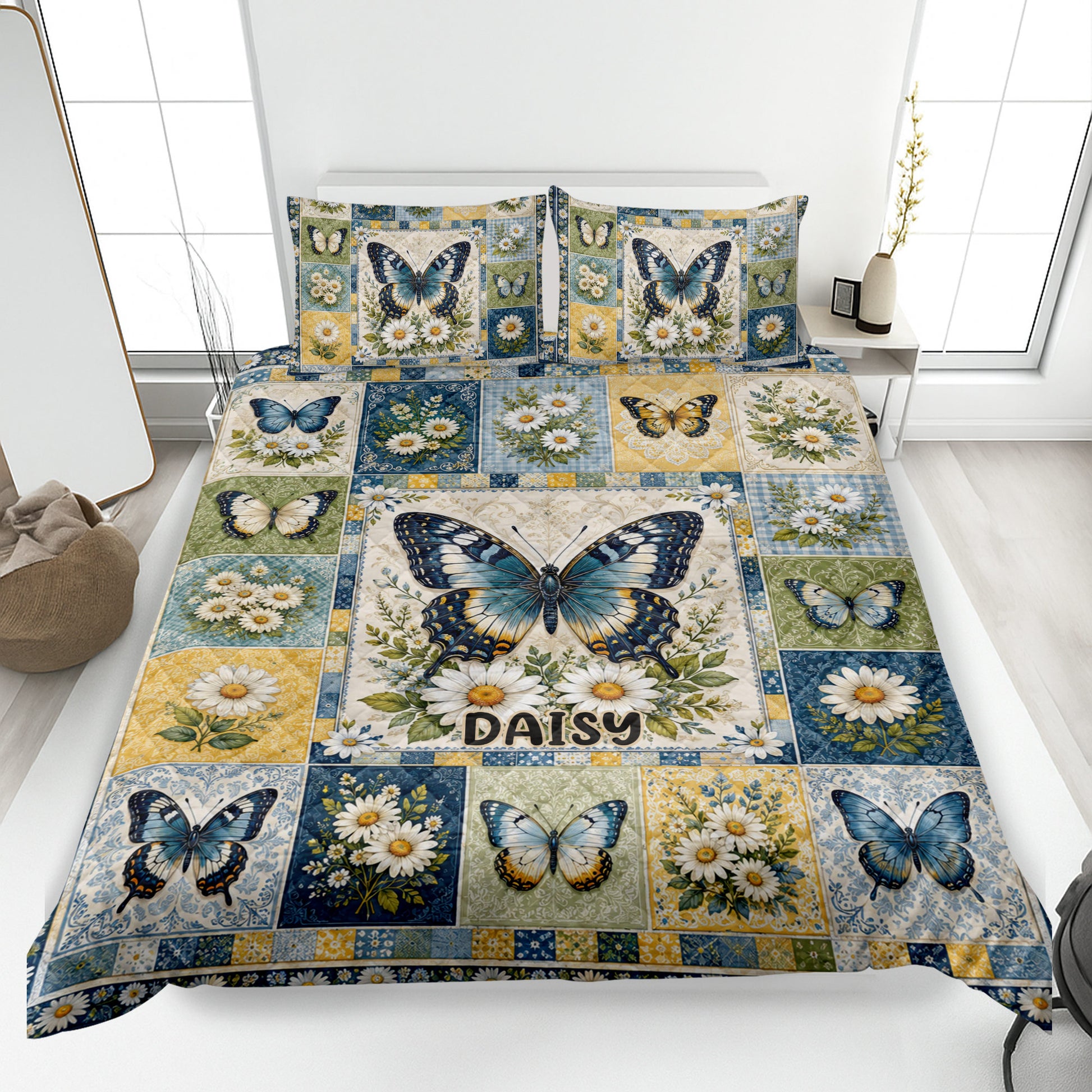 Butterfly quilt blanket displayed on a bed with blue, gold, green, and daisy patchwork artwork