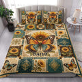 Butterfly and sunflower quilt bedding styled in a bright bedroom with coordinated botanical artwork