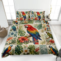 Parrot quilt blanket displayed on a bed with colorful macaws, tropical leaves, hibiscus flowers, and a custom design