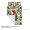 Parrot quilt blanket detail showing the printed tropical artwork and white quilted backing