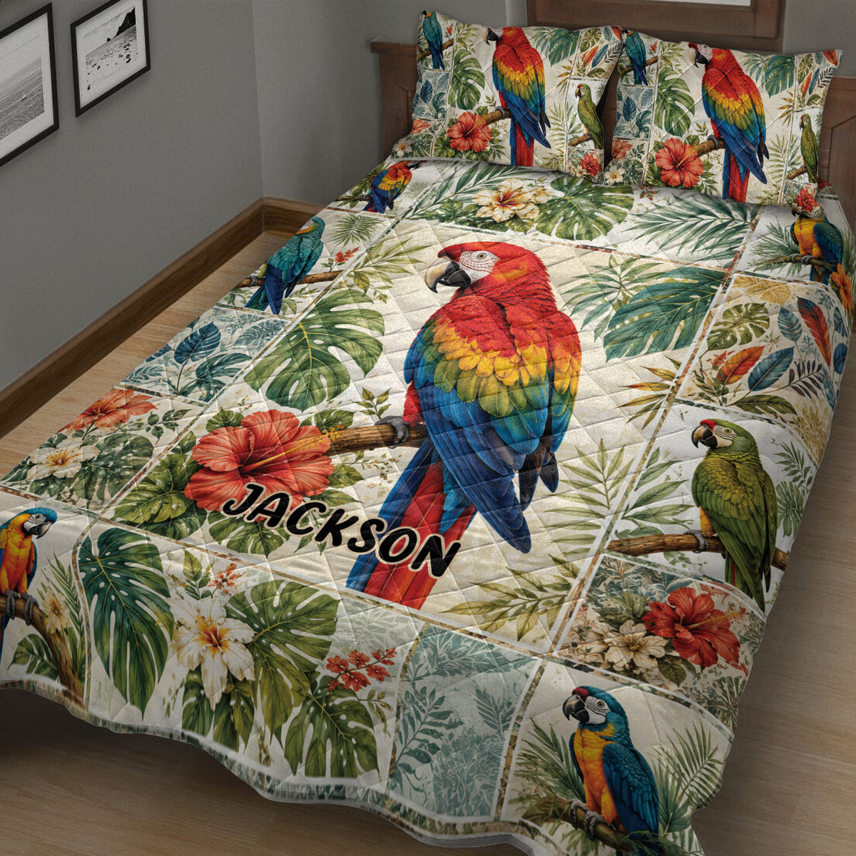 Close bedroom view of a parrot quilt blanket featuring a large red macaw, green foliage, and tropical flowers