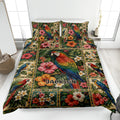 Parrot quilt blanket displayed on a bed with tropical flowers, foliage, and colorful macaw artwork
