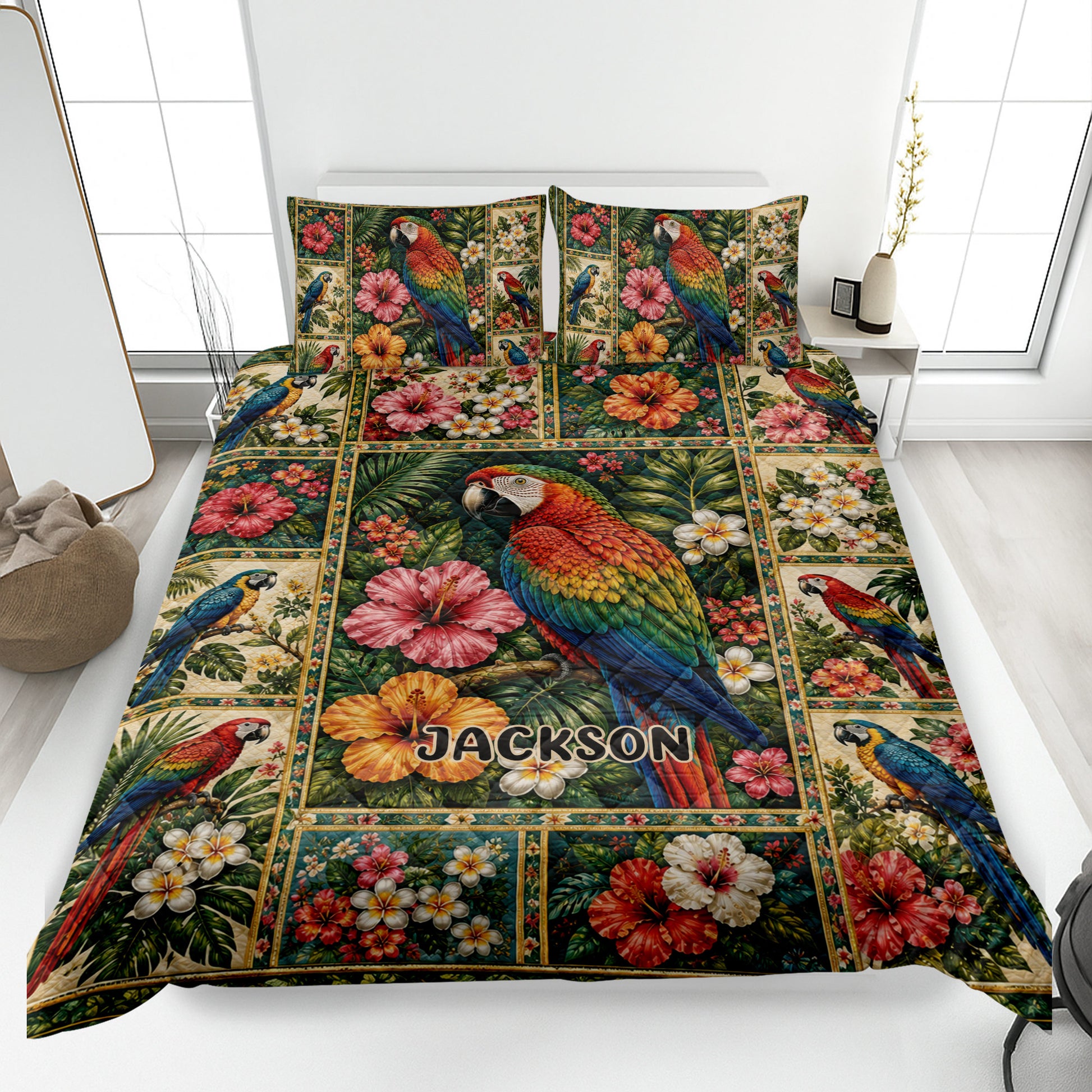 Parrot quilt blanket displayed on a bed with tropical flowers, foliage, and colorful macaw artwork