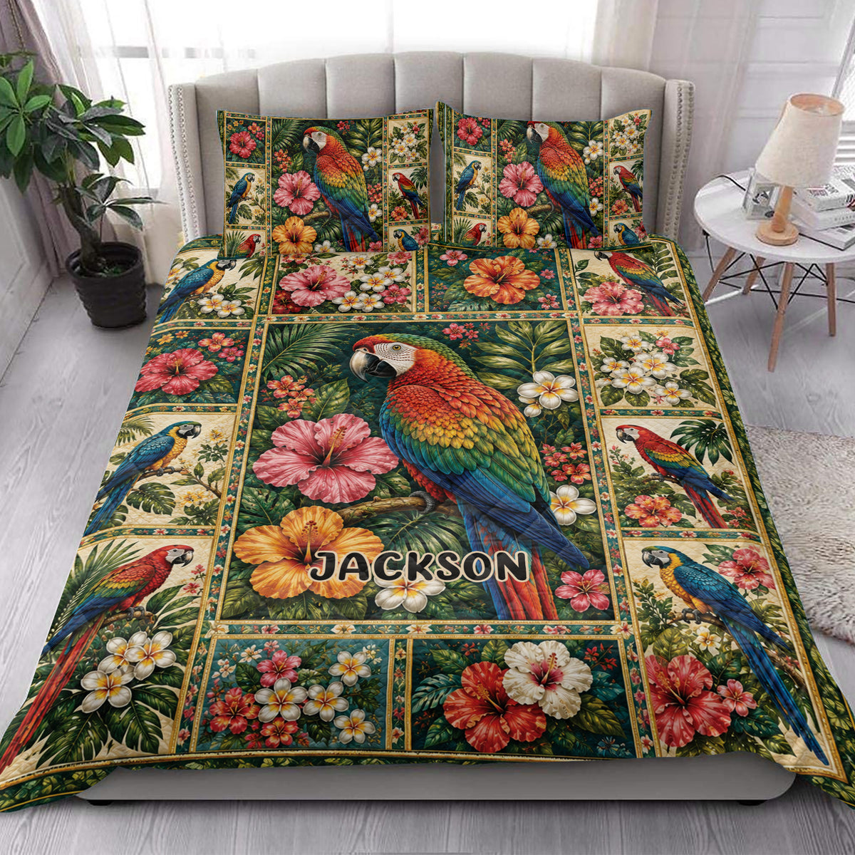Colorful parrot quilt blanket styled across a bright bedroom with tropical floral artwork