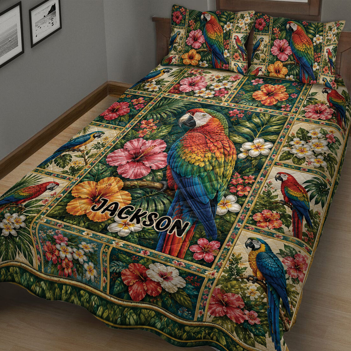 Close bedroom view of a parrot quilt blanket covered in macaws, hibiscus flowers, and tropical leaves