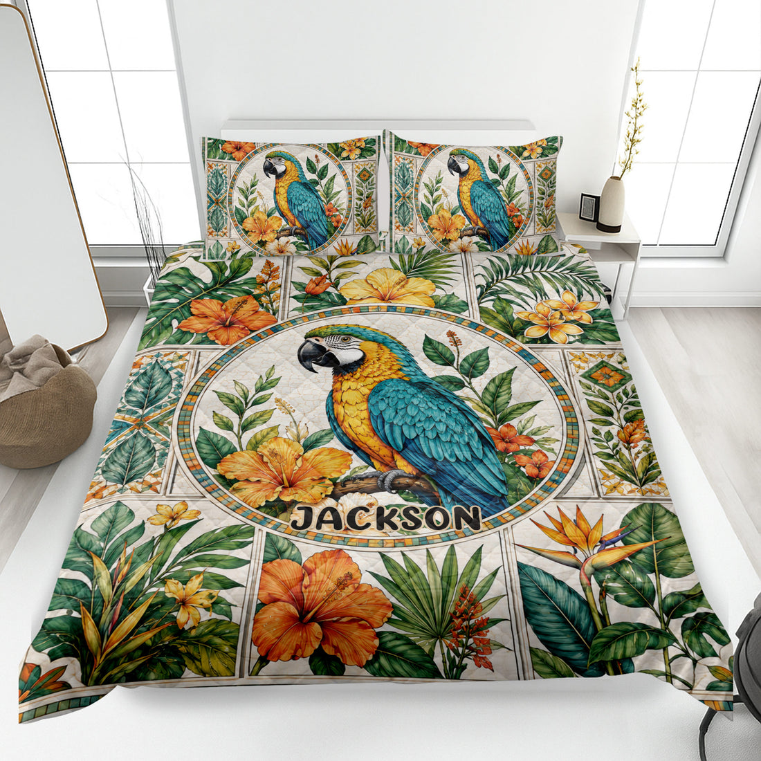 Tropical parrot quilt blanket spread across a bright bedroom with floral foliage artwork