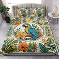 Colorful parrot quilt blanket styled on a bright bedroom bed with tropical floral artwork