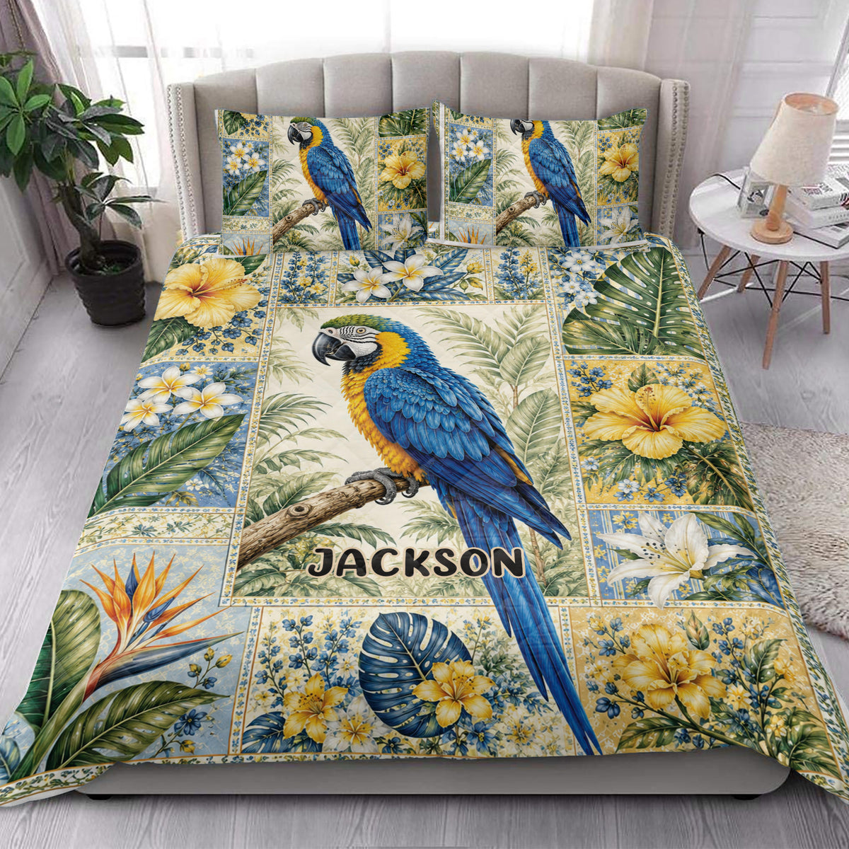 Blue macaw parrot quilt blanket styled in a bright bedroom with tropical floral artwork
