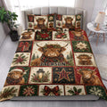 Highland cow Christmas quilt blanket styled on a bright bedroom bed with matching holiday artwork
