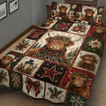 Close bedroom view of a Highland cow Christmas quilt with plaid accents, holly, poinsettias, and ornaments