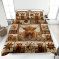 Highland cow quilt blanket displayed on a bed with floral blocks, plaid accents, and rustic star motifs