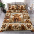 Highland cow quilt bedding set styled in a bright bedroom with matching cattle artwork and floral accents