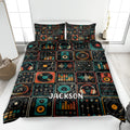 DJ quilt blanket displayed on a bed with turntables, headphones, mixers, equalizers, and colorful music artwork