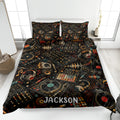 DJ quilt blanket displayed on a bed with turntables, headphones, mixers, records, and colorful soundwave artwork