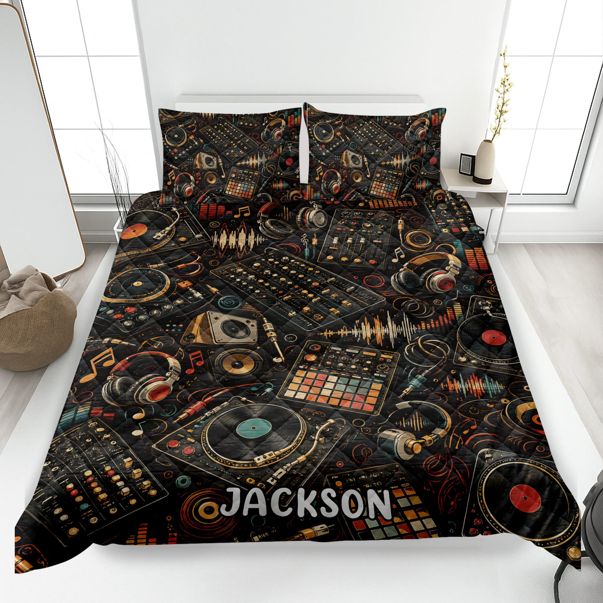 DJ quilt blanket displayed on a bed with turntables, headphones, mixers, records, and colorful soundwave artwork