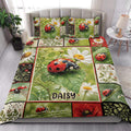 Ladybug quilt bedding set styled in a bright bedroom with daisies and leafy botanical artwork