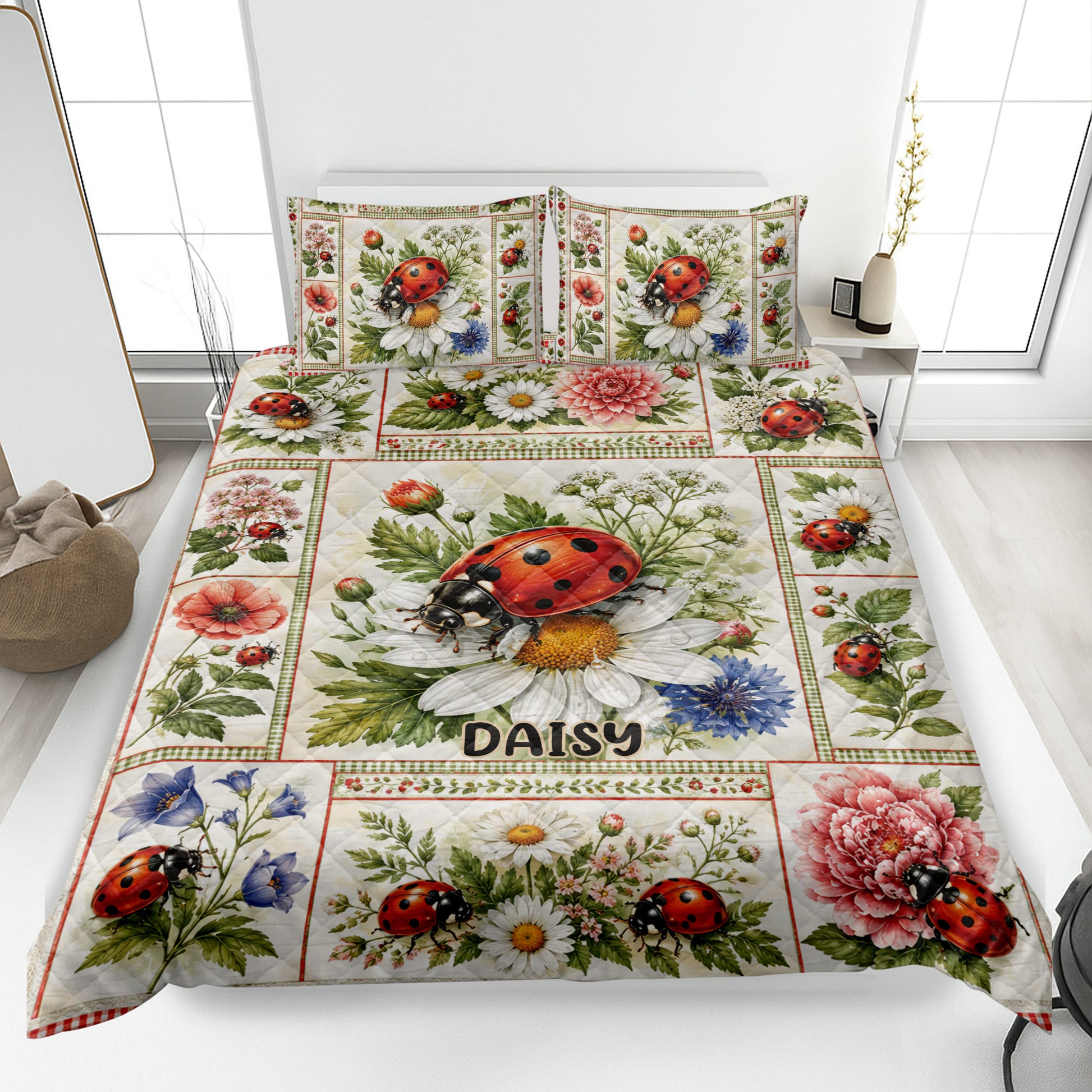 Ladybug quilt blanket bedding set displayed on a bed with flowers, leaves, and red gingham borders