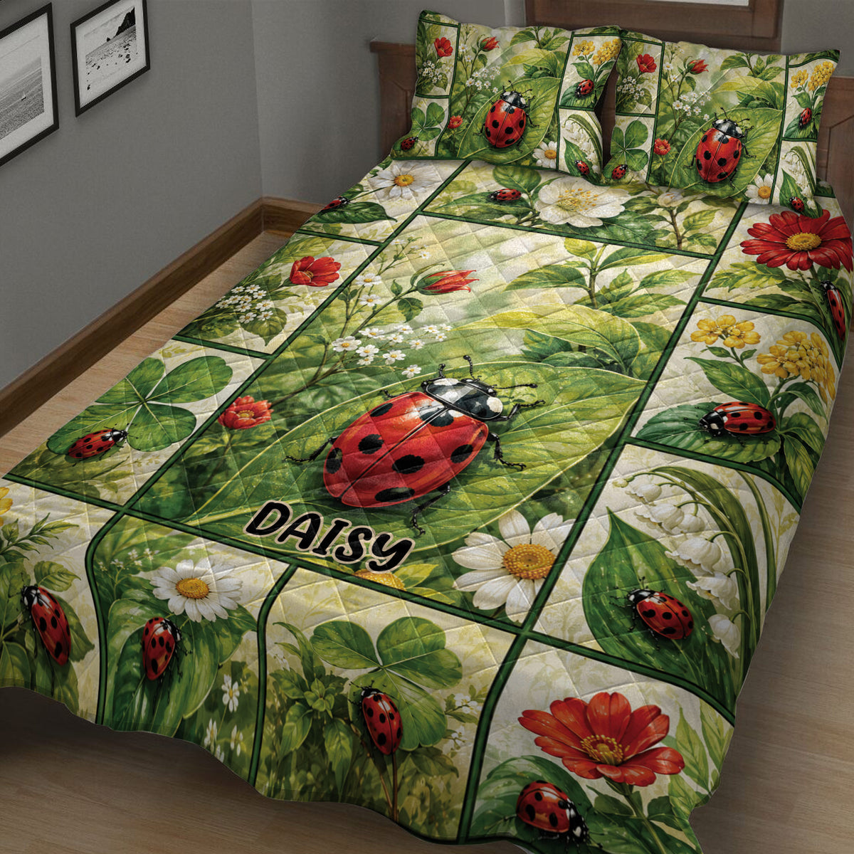 Close angled view of a ladybug quilt blanket with lush leaves, daisies, and colorful floral artwork