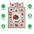 Ladybug quilt bedding set shown with floral insect artwork and care feature icons