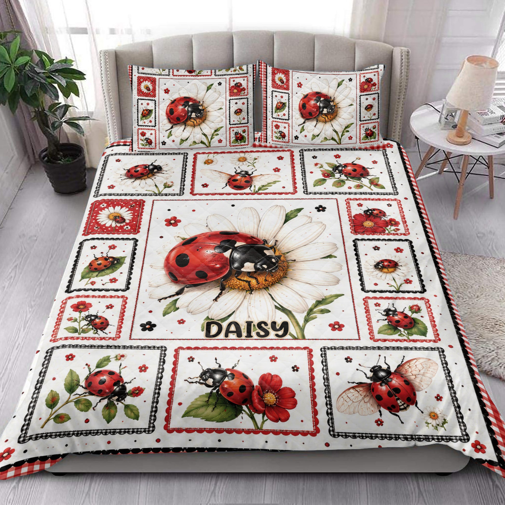 Ladybug quilt blanket styled in a bright bedroom with matching floral ladybug artwork