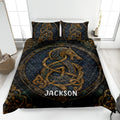 Viking quilt blanket in a bedroom with dark blue and gold Norse dragon artwork
